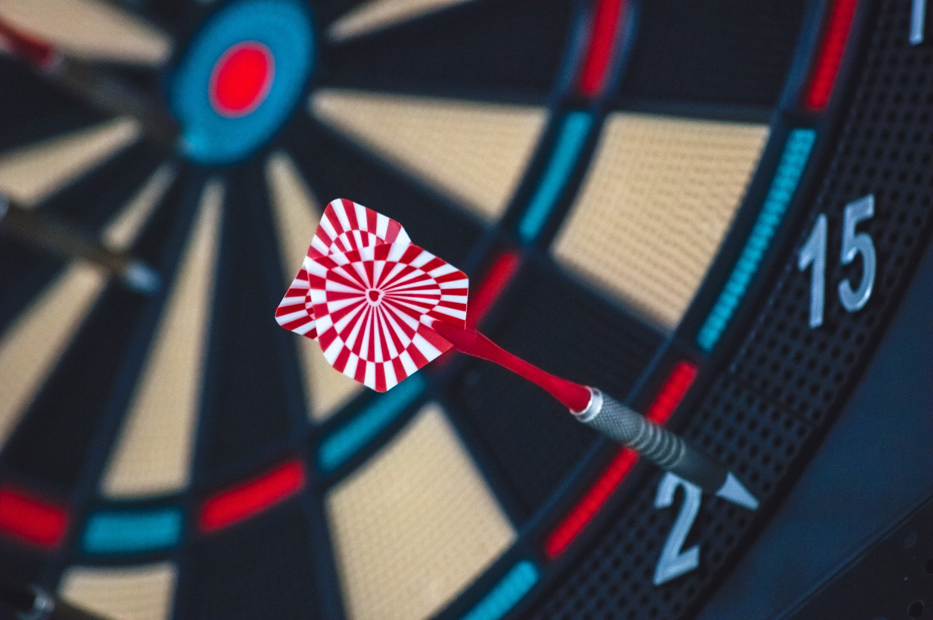 Dart on a dartboard missing the target